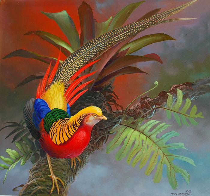A golden pheasant among red and green foliage