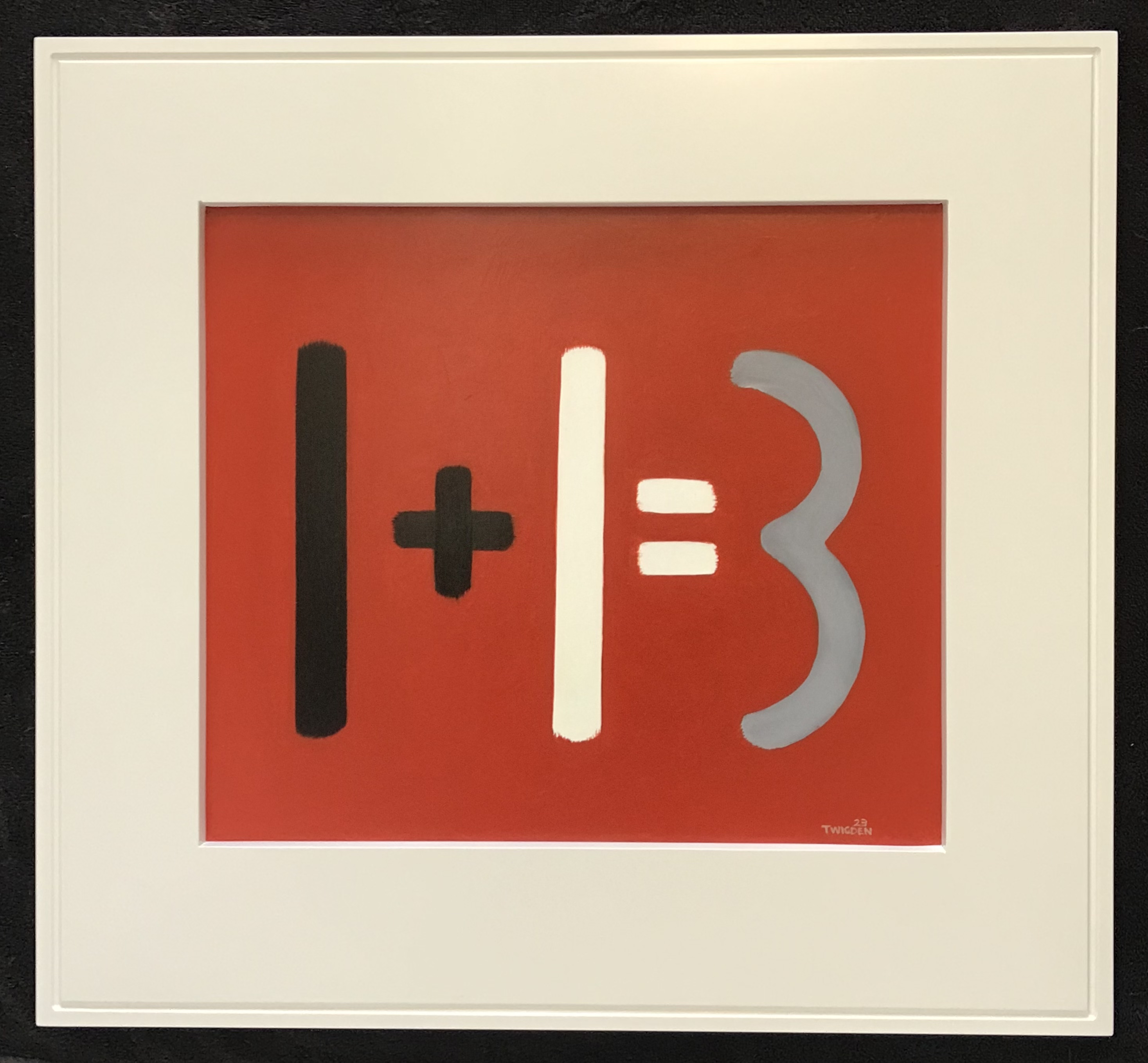 The equation one plus one equals three painted in black, white and grey on red